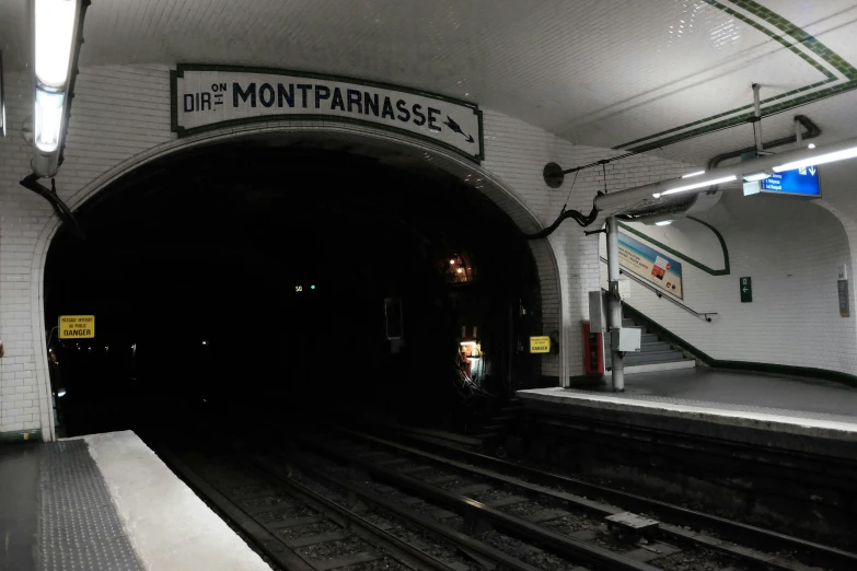 a subway is shown in black and white with some light on