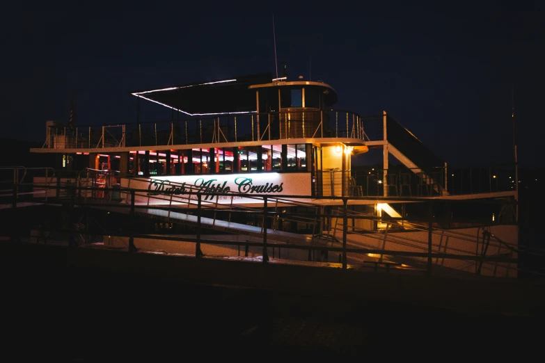 a building is lit up at night with a long exposure