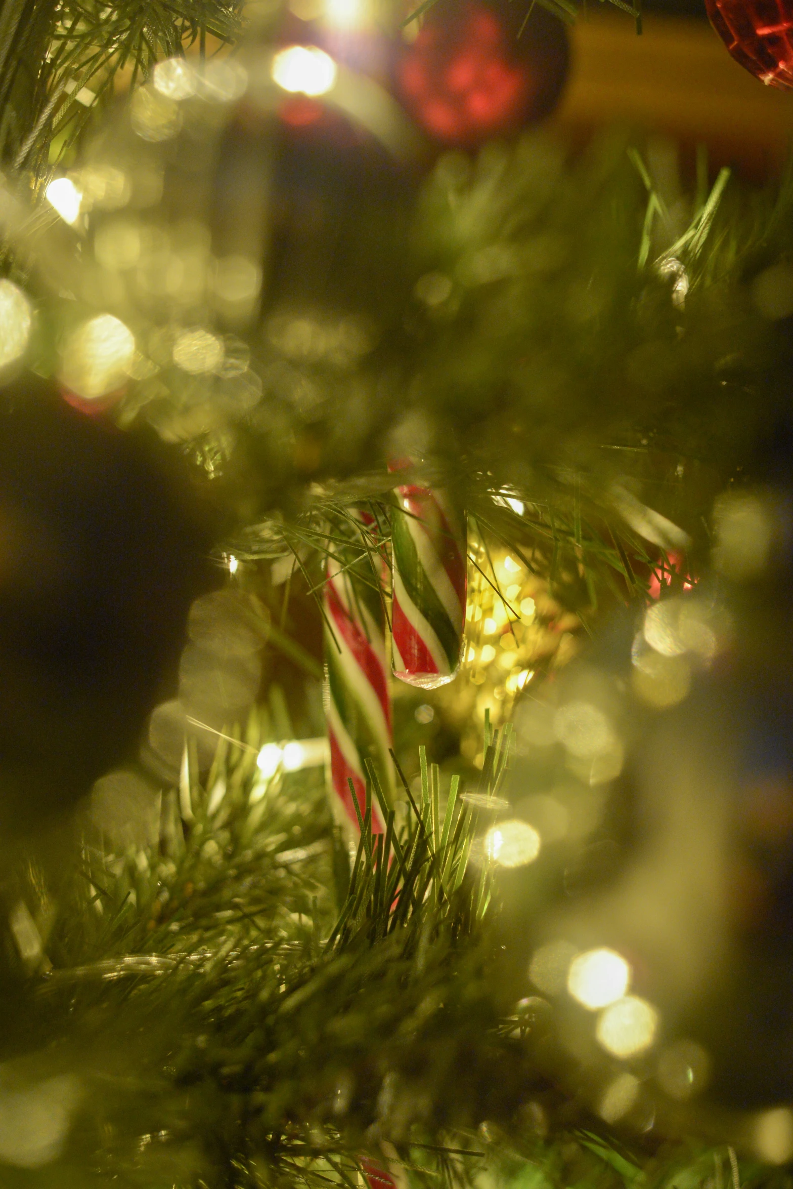 the ornaments are hanging from the christmas tree