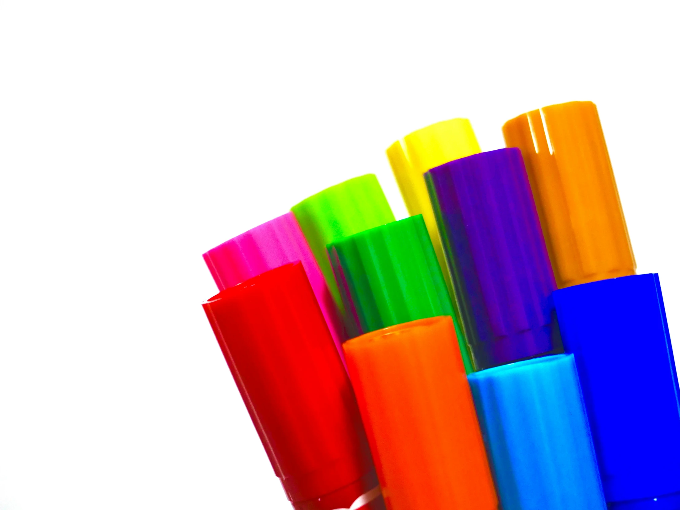 several colorful candles sitting next to each other