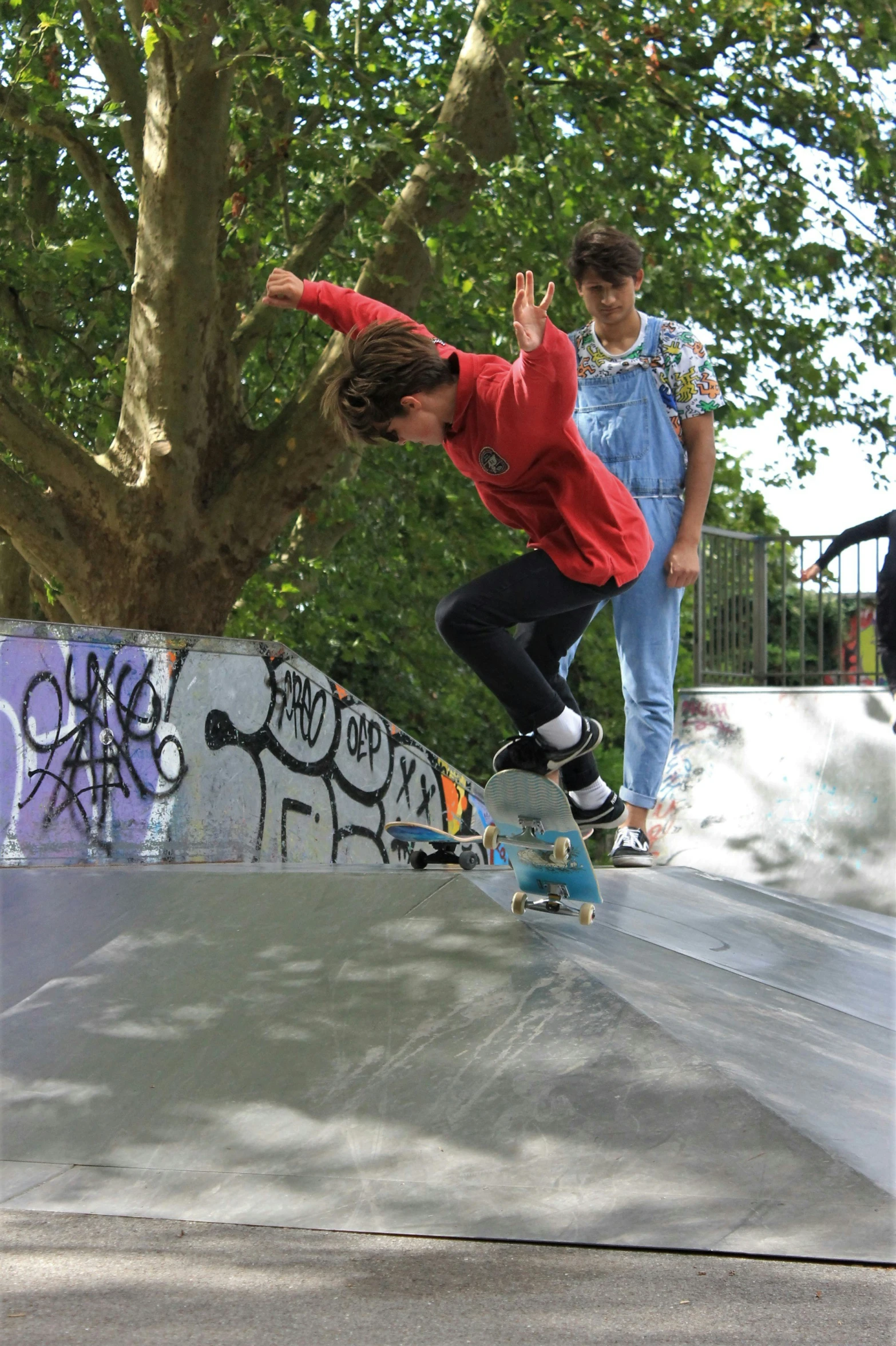 a young man is riding a skateboard on a ramp