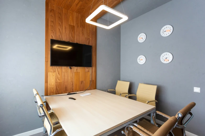 an office with three chairs and a flat screen tv