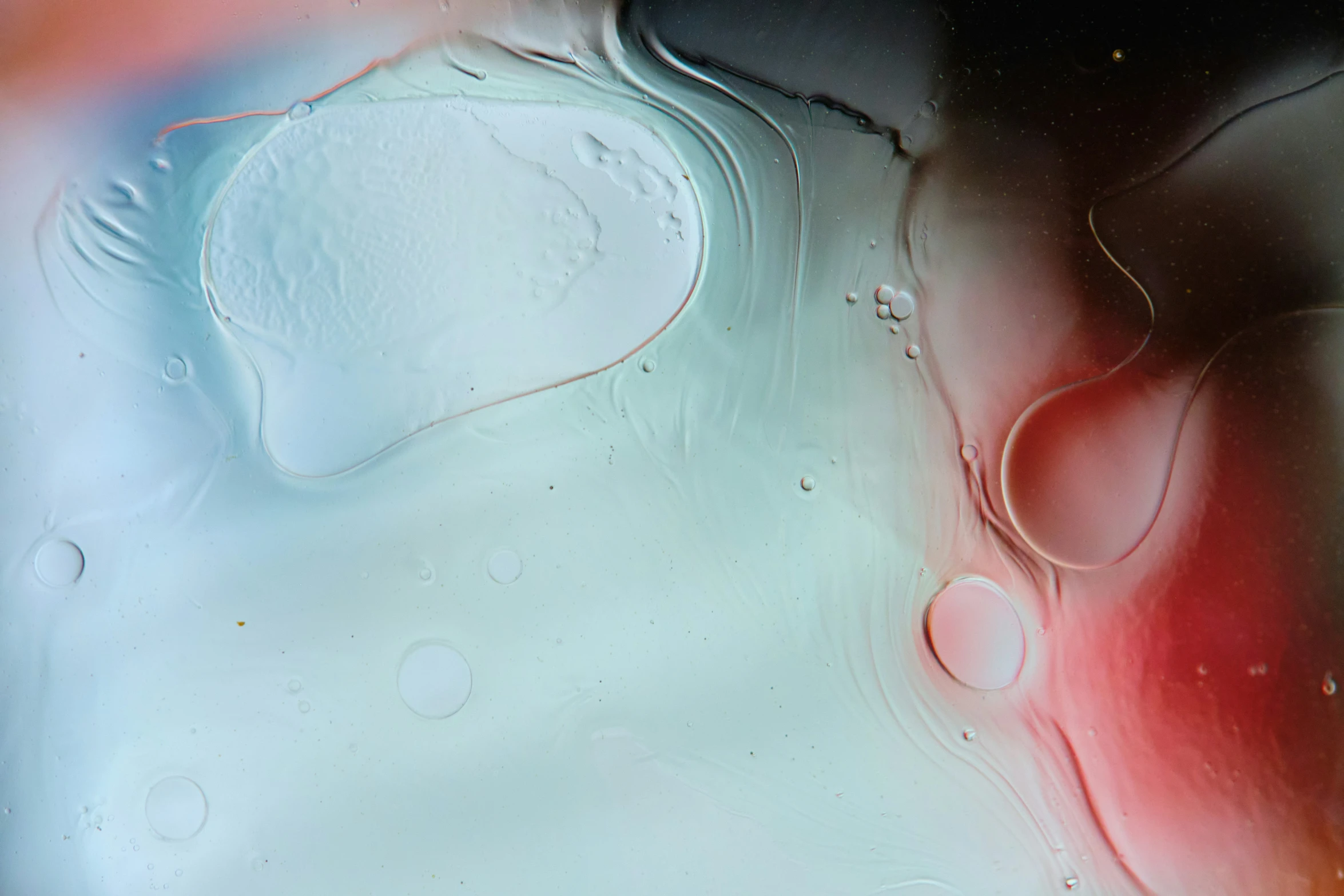 the back of an abstract glass wall with various drops