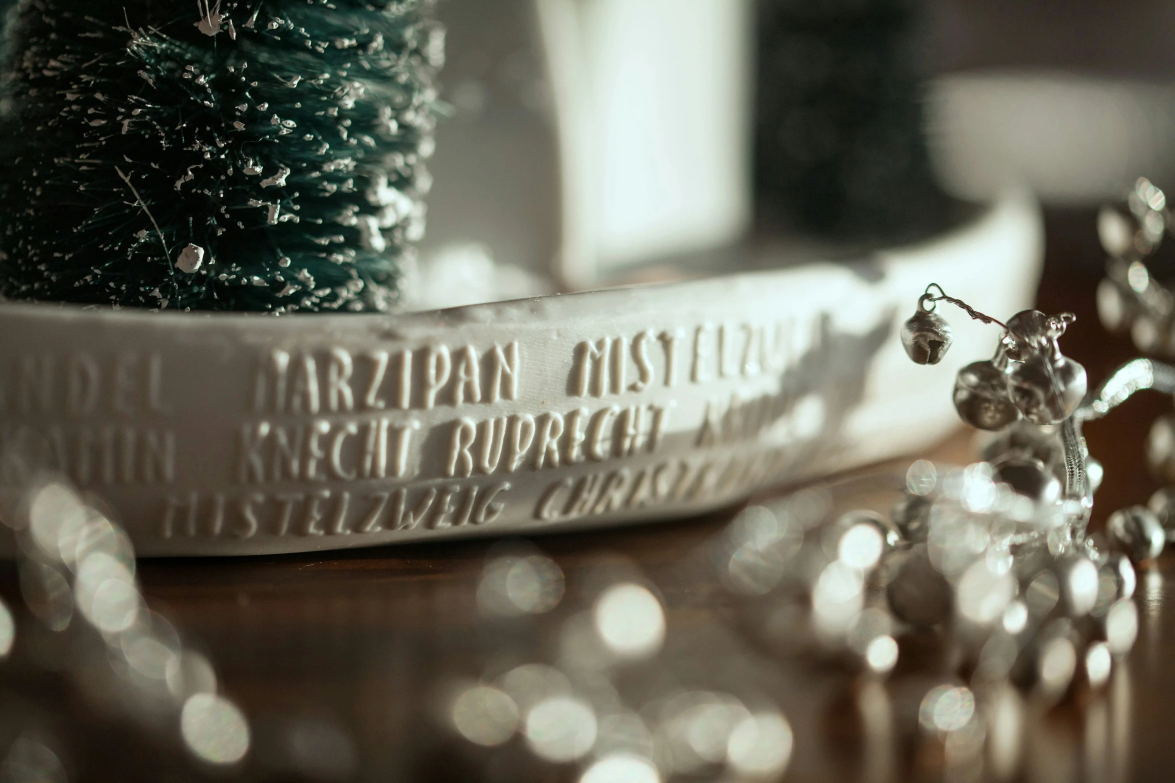 a crystal bead sitting next to a can and potted plant