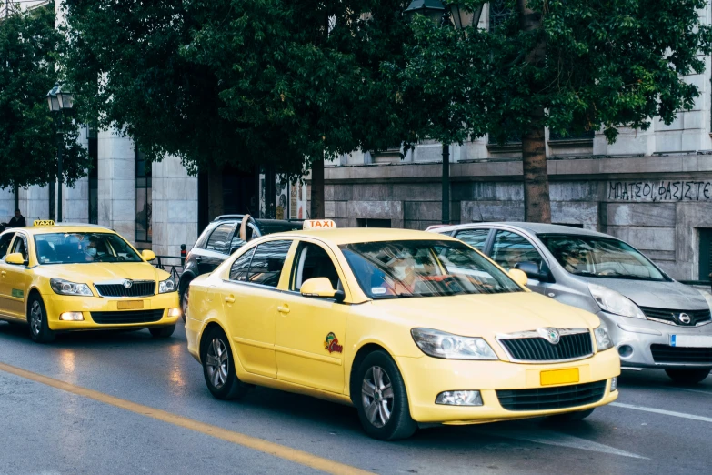 taxi cabs are lined up on the street