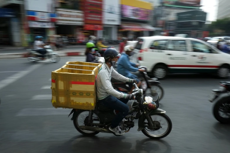 people riding motorcycles on the street while people pass by