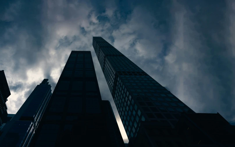 a po of two tall buildings in the dark