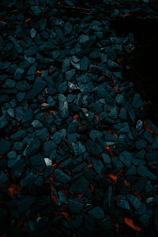 a po of rocks and flames on an outdoor stove