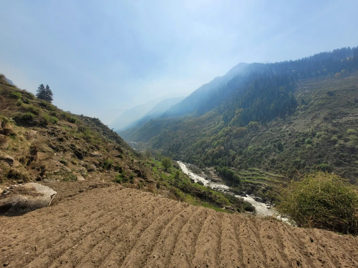 a plowed road that runs along the hillside