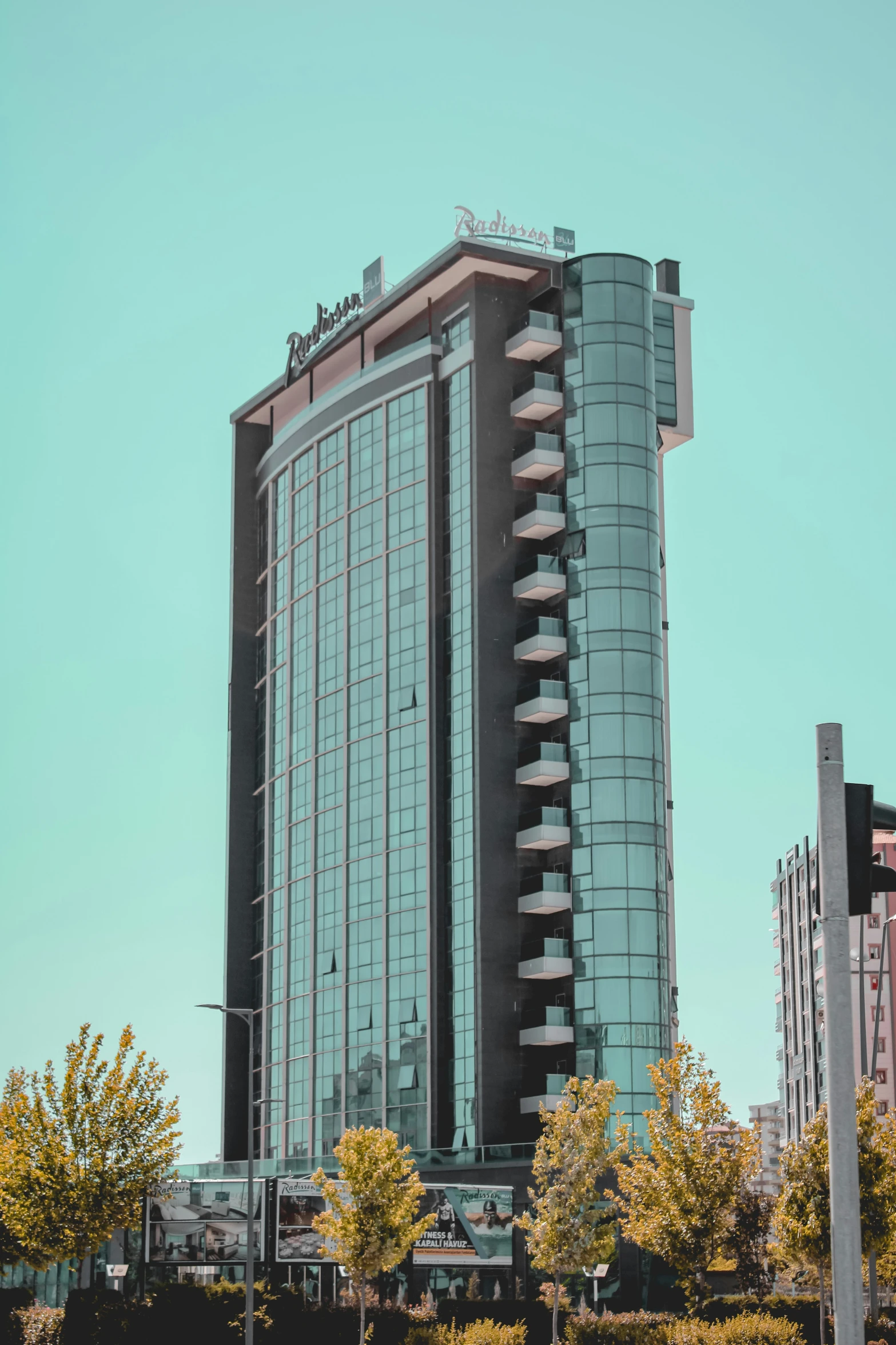 a tall building with a clock tower in the background