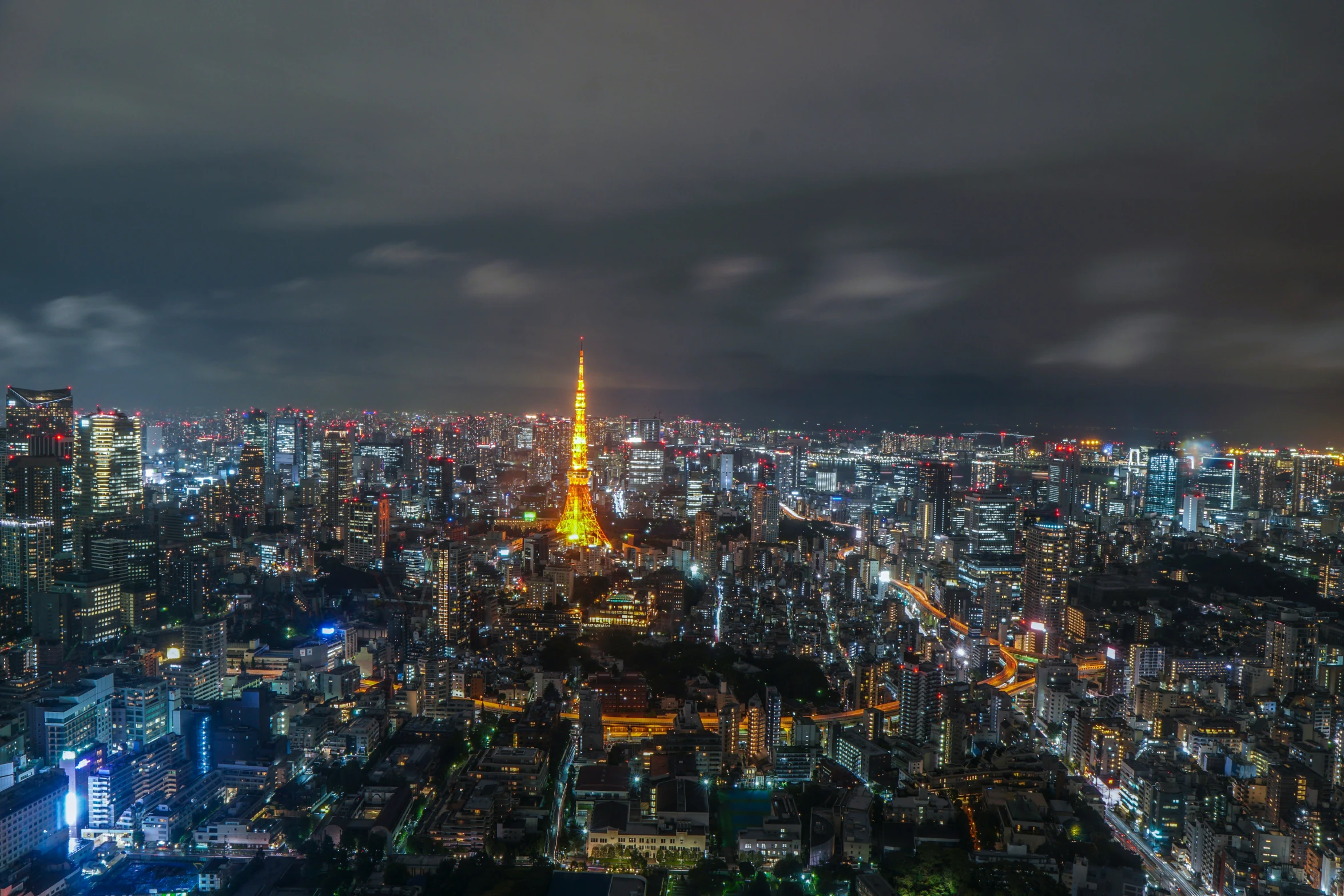 a city in the distance at night time