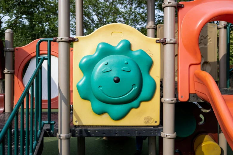 a children's play structure with colorful playground equipment