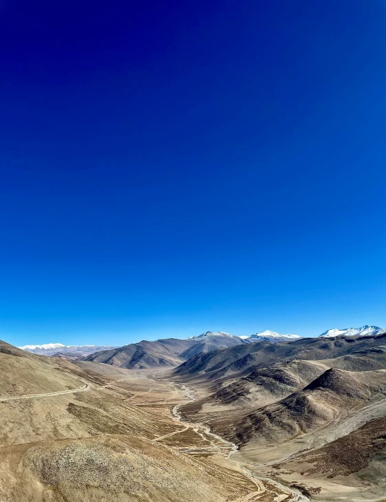 a scenic view of a large mountain range