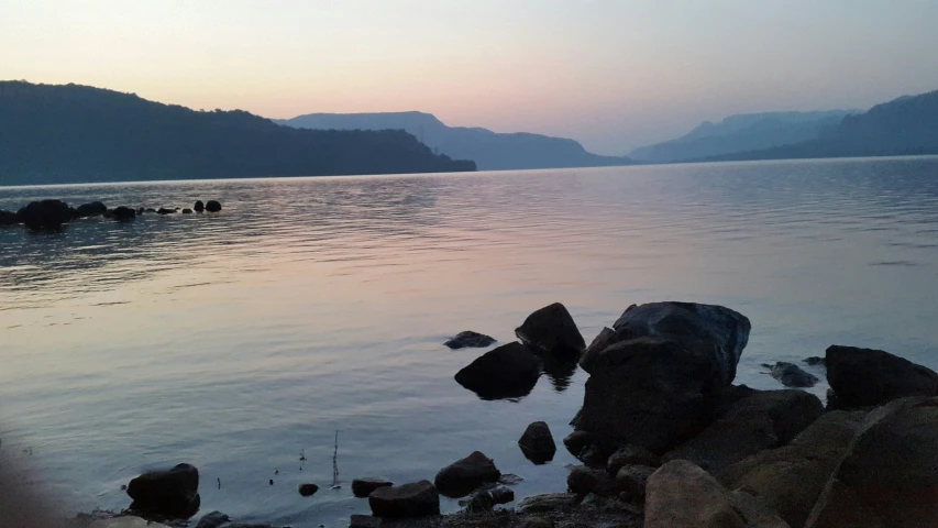 a view of mountains across the water