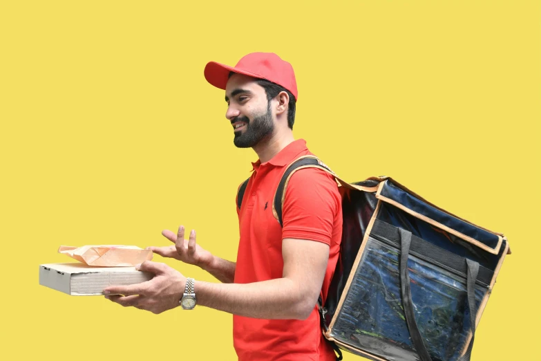 man carrying two sandwich packs on yellow background