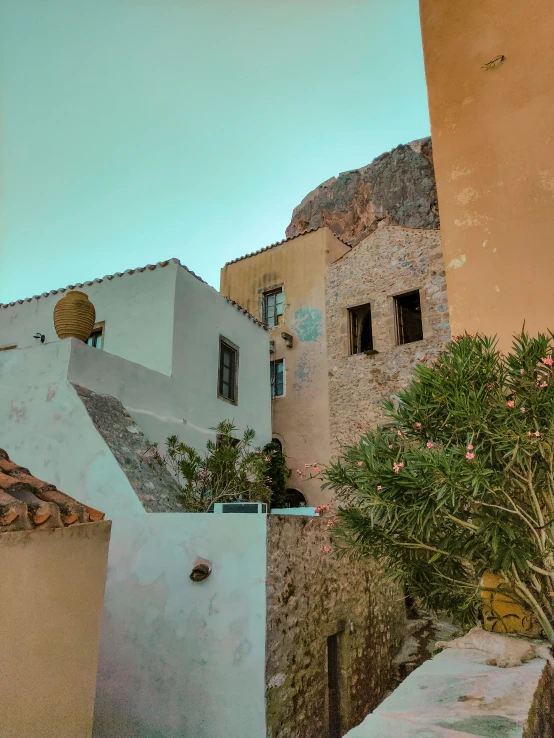 a pograph taken from the ground of a building with some windows