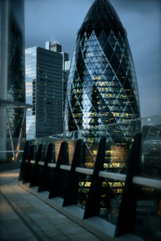 an urban city view shows the ghere's dome and surrounding skyscrs