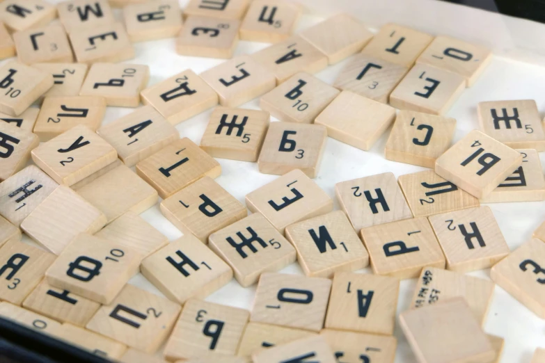 the alphabet of scrabbles arranged neatly on a surface