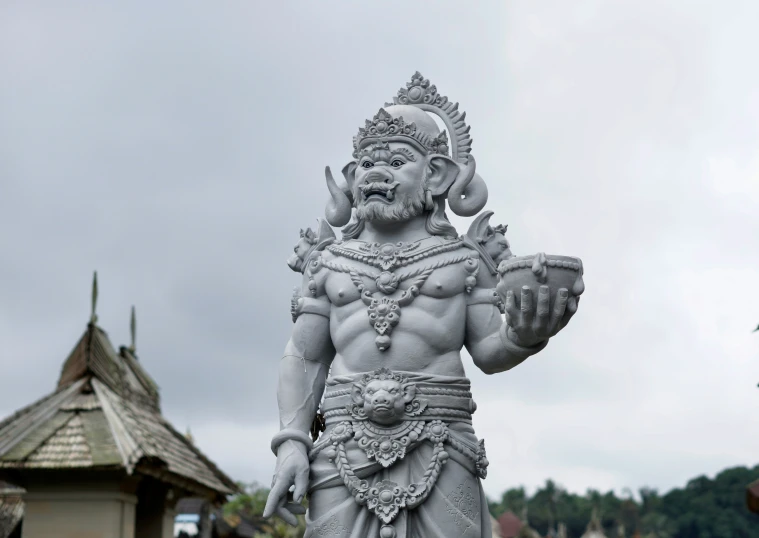 a statue of a god, some with horns and some with a bow