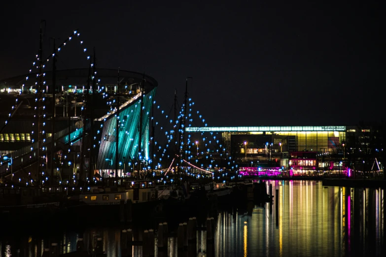 there is a night scene with lights on this boat