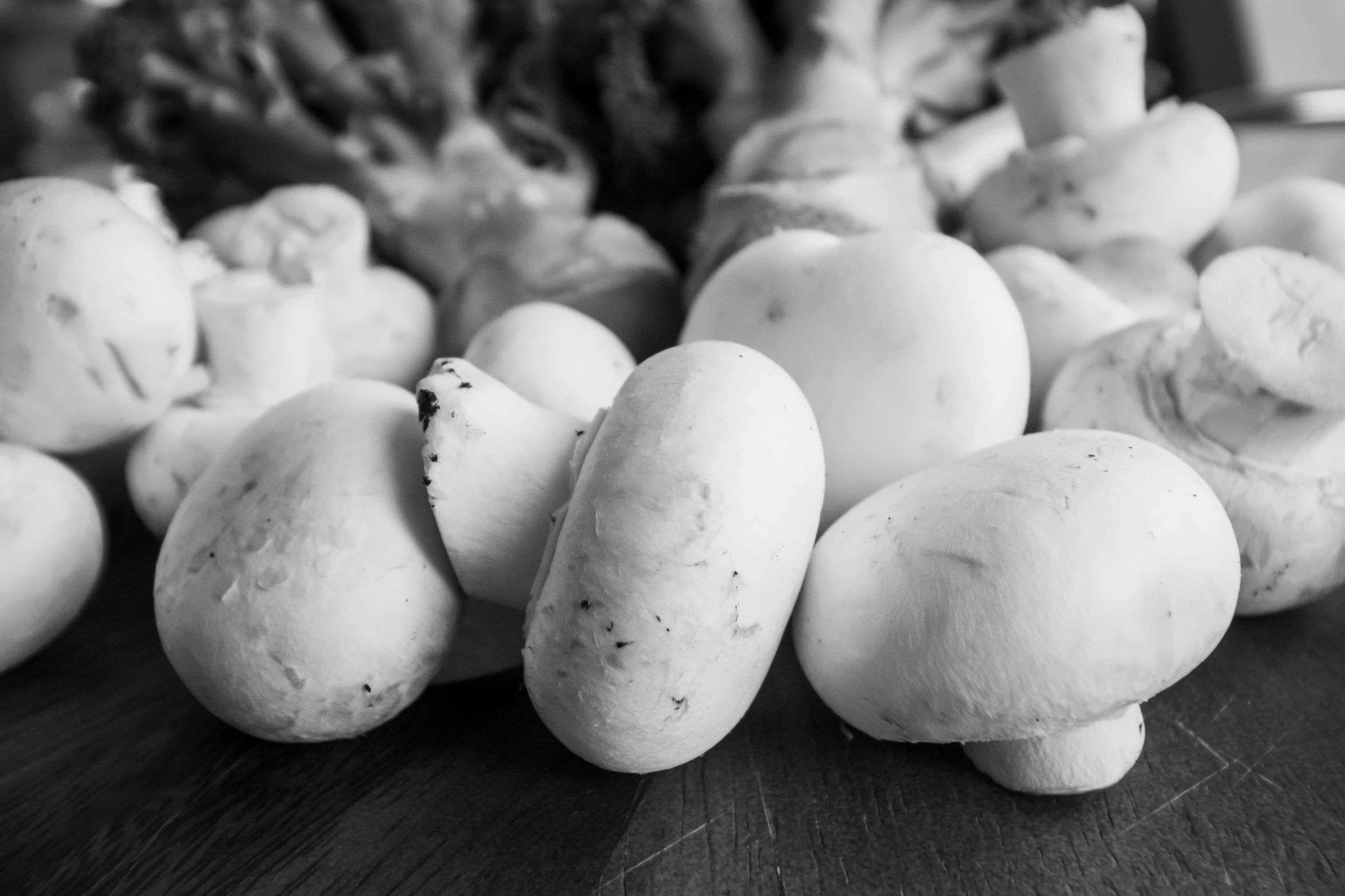 a pile of mushrooms sitting next to a pile of mushrooms