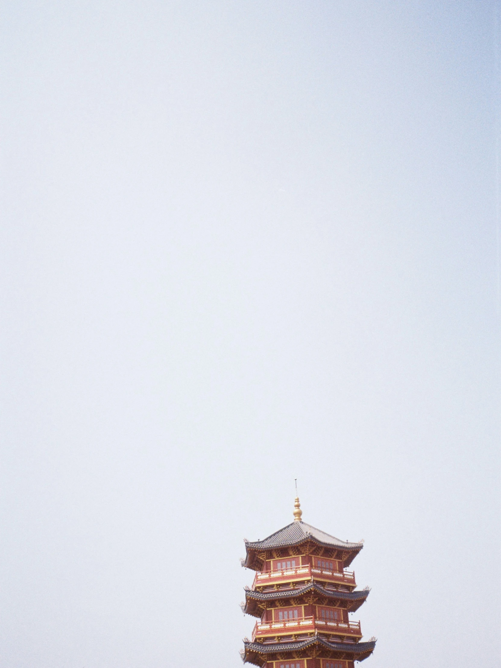 the pagoda of an asian temple has a tall spire