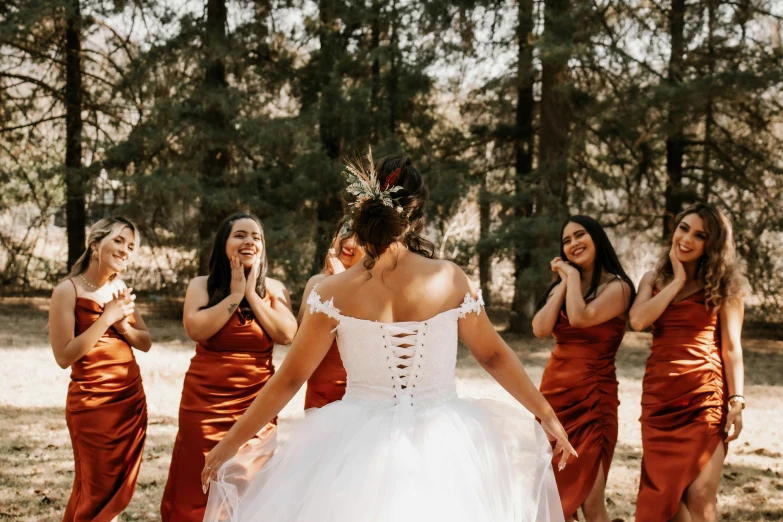 a woman in a dress that is pulling over her dress