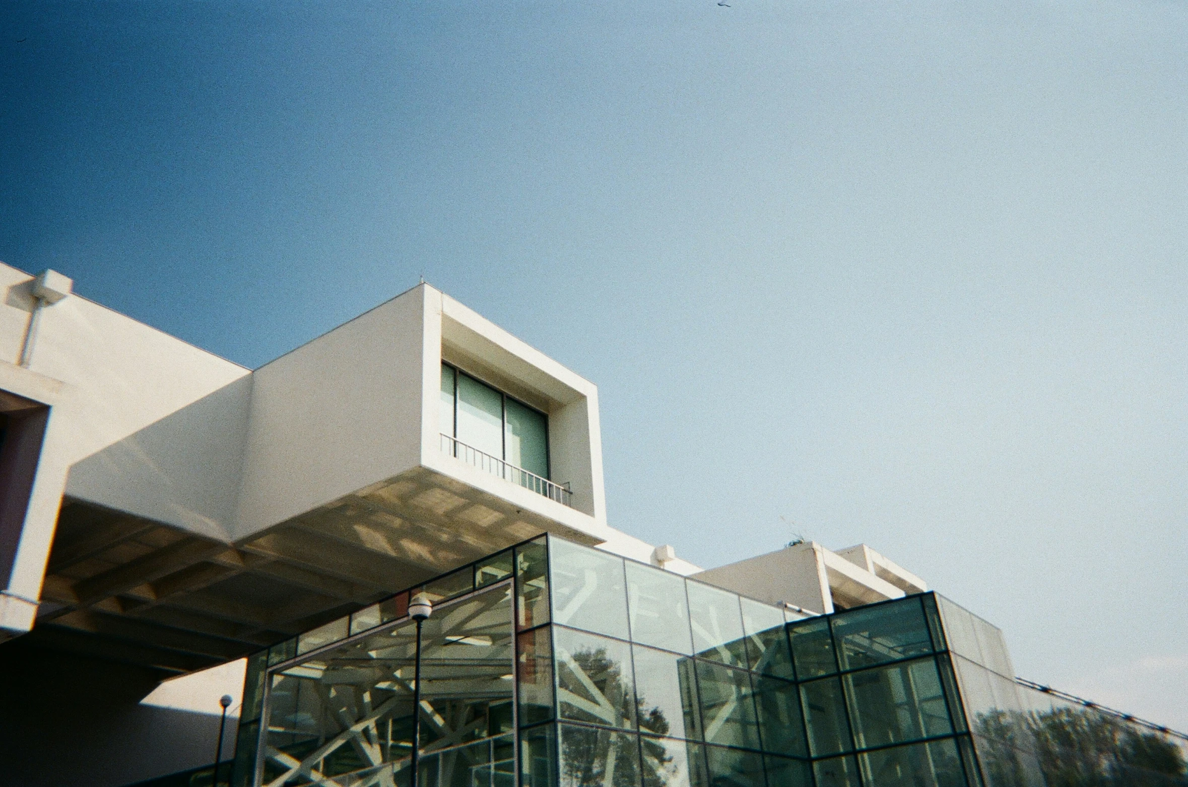 the side of a large white building on a sunny day