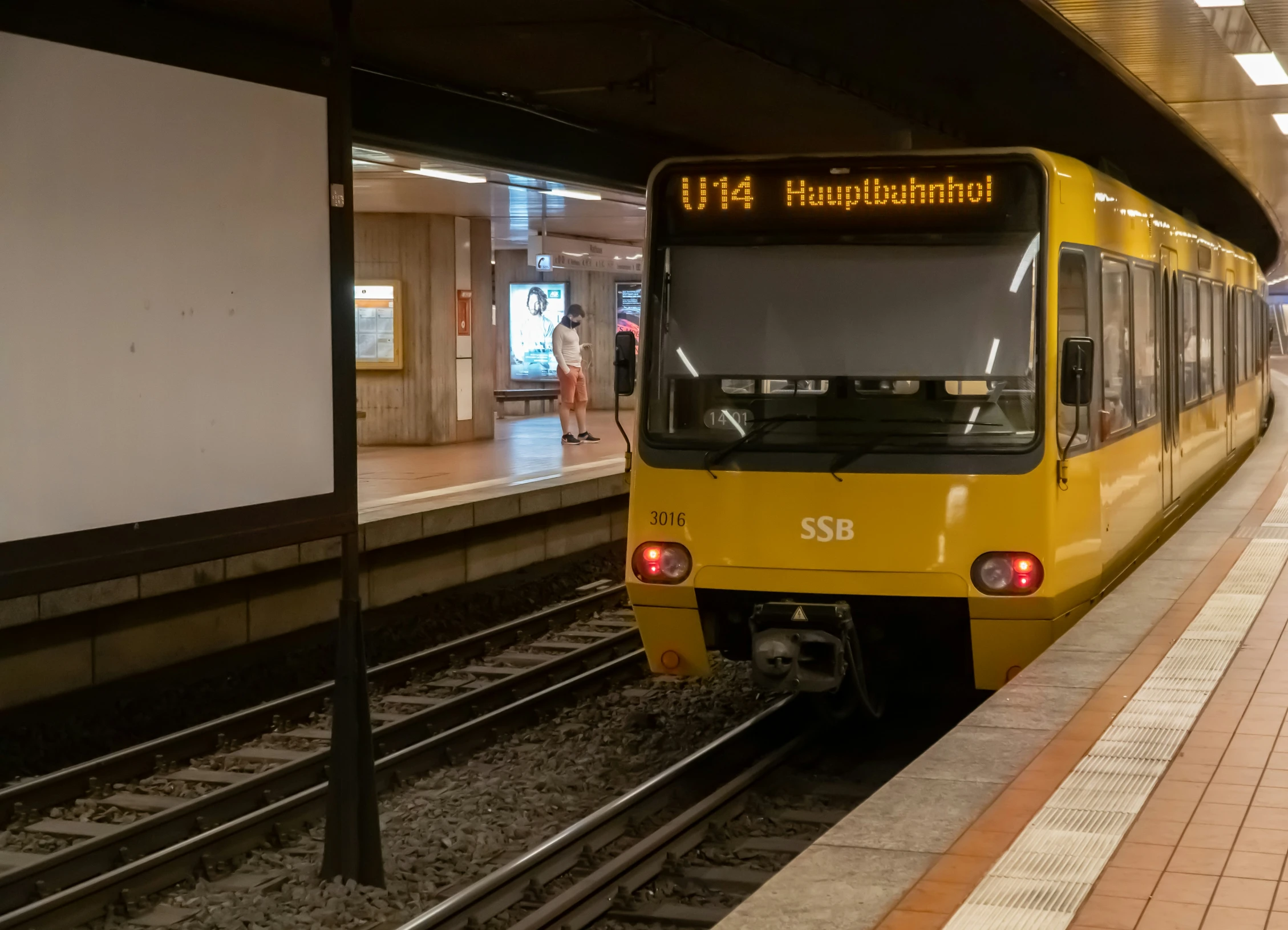 a passenger train stopped at a train station