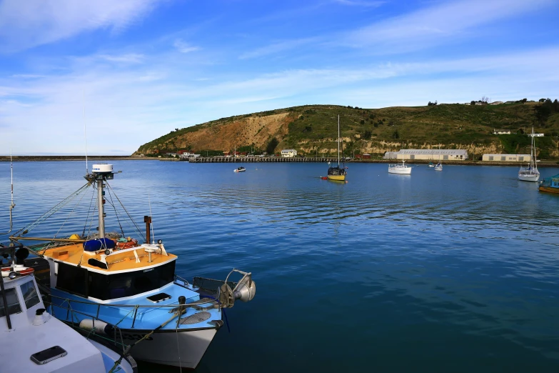 small boats sit in the calm water