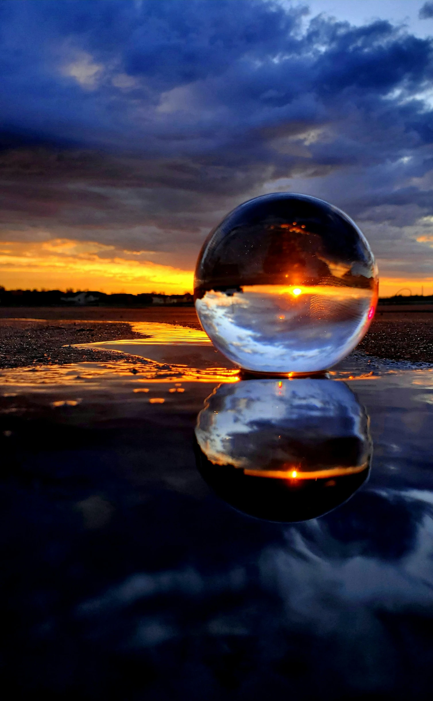 the sky is shown behind a large mirror ball