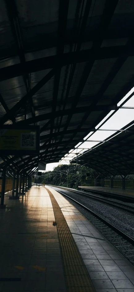 there is an empty platform that has many tracks