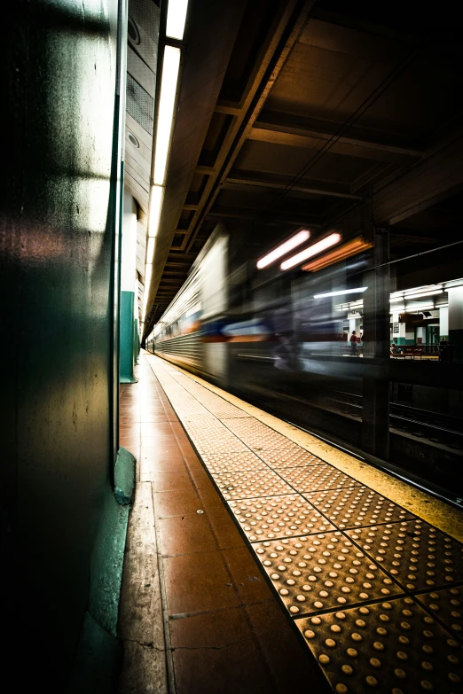 subway with blurry lights coming out the middle of it