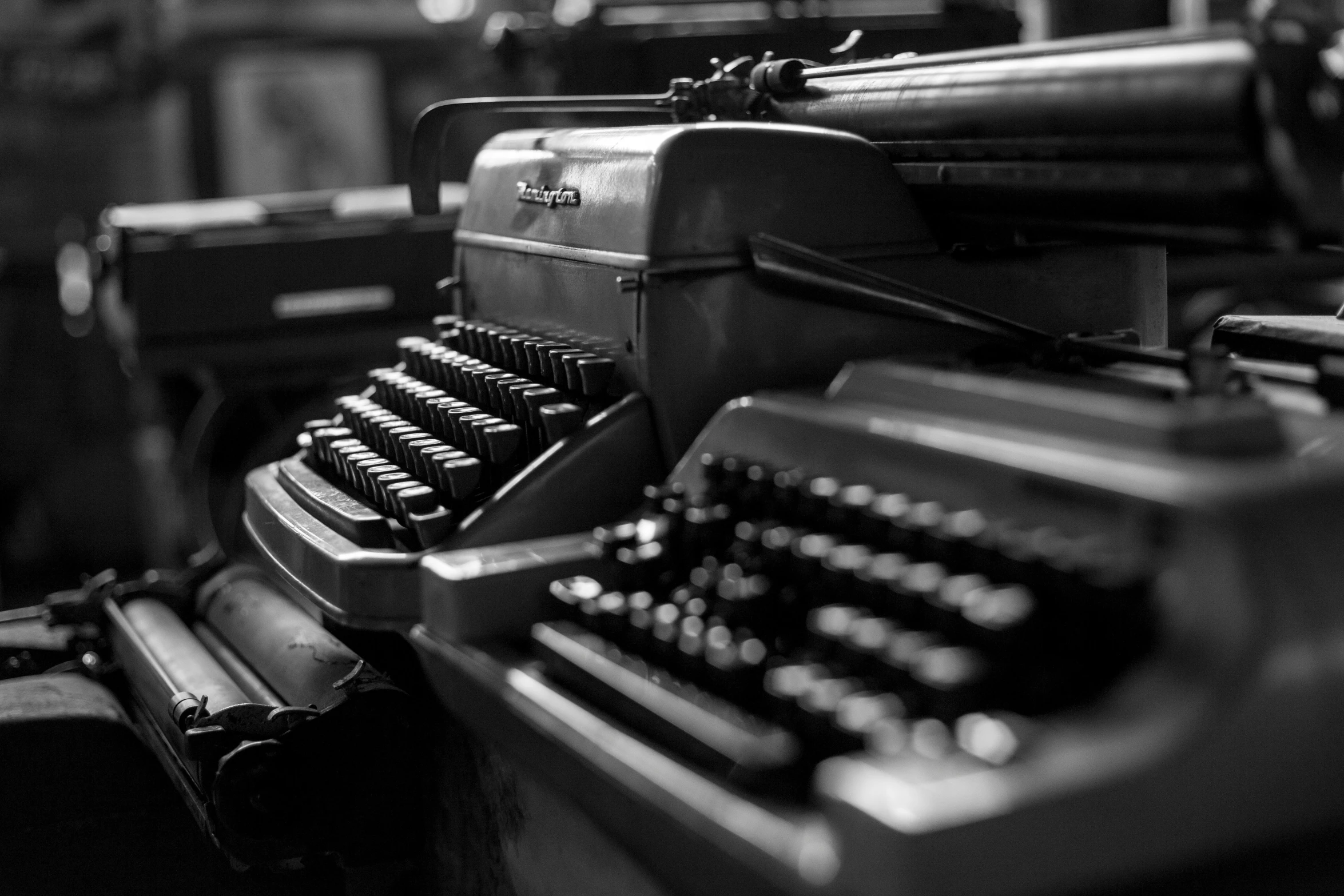 an old fashioned typewriter sits next to some chairs