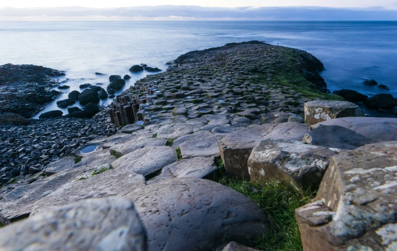 large rock formations by the sea on an cloudy day