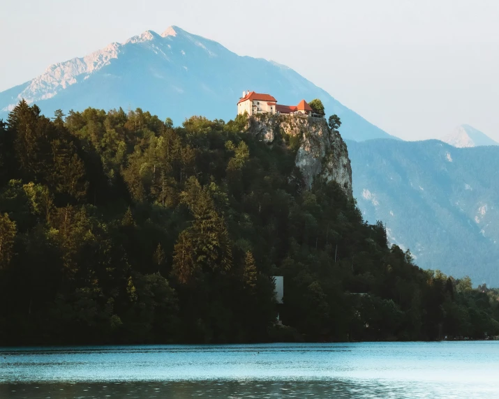 a picture of a castle on top of a mountain