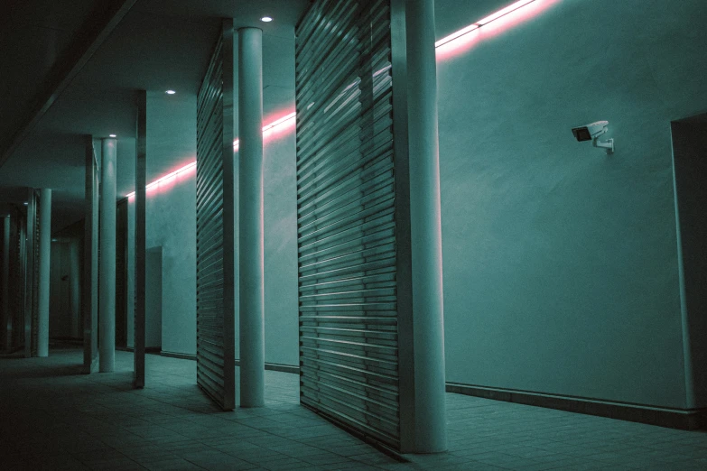 a row of storage units lined up along a hallway