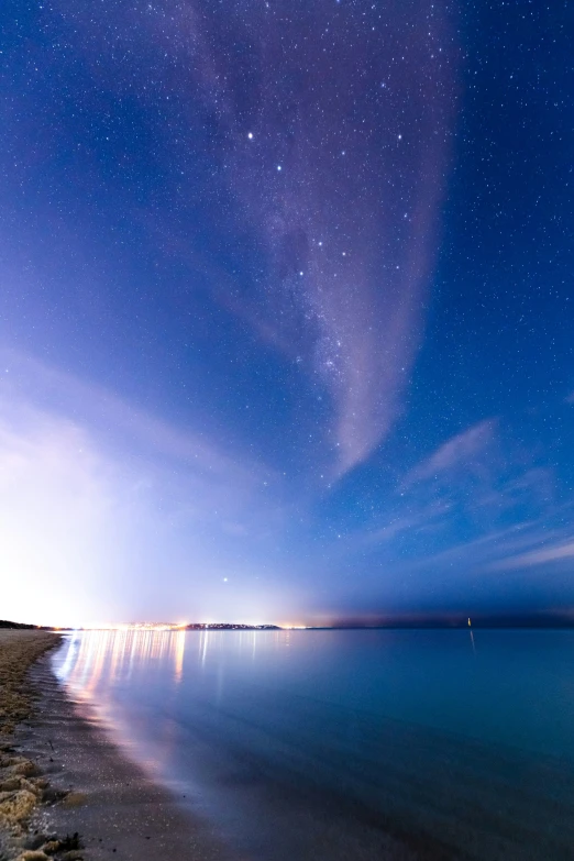 the stars are flying over a lake that is in the distance