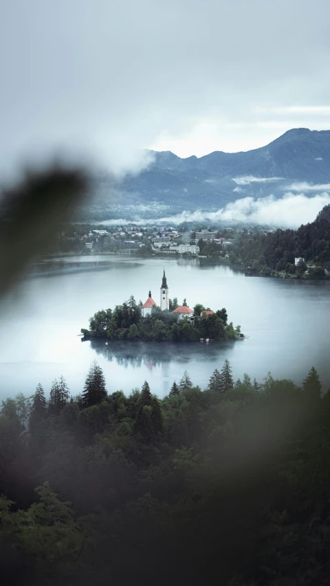 a small island sits in the middle of a lake