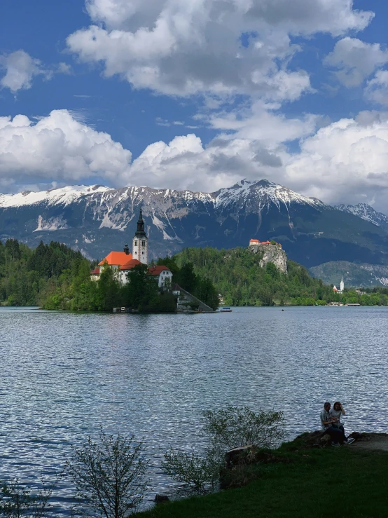 some buildings on some water and trees