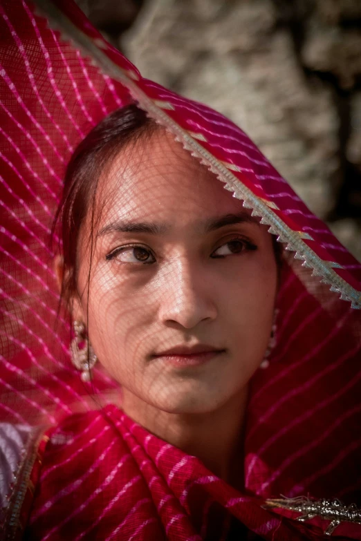 a woman with a colorful dress and head scarf