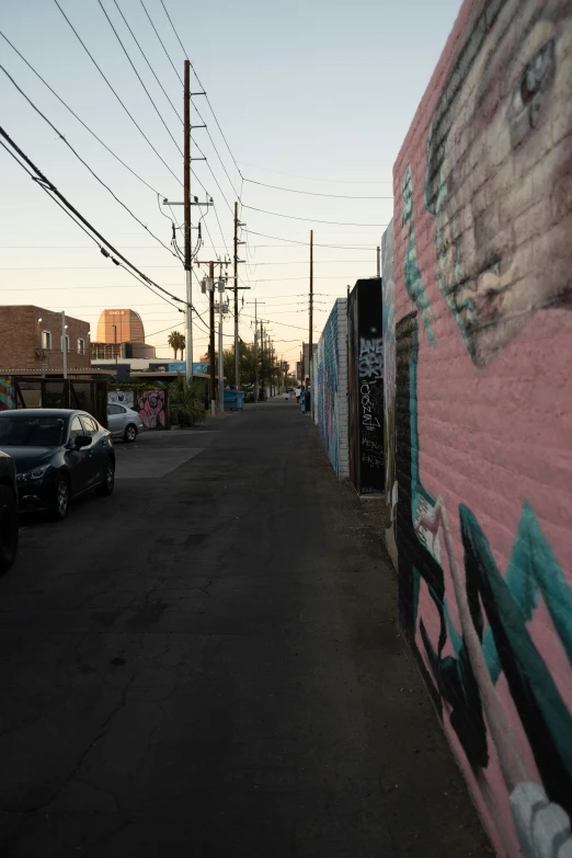 a line of cars parked along a side walk