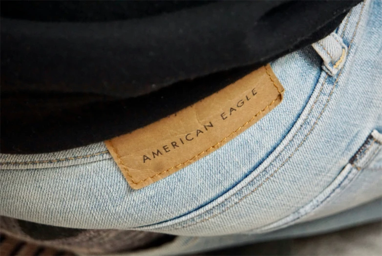 an american eagle label sits on a pair of blue jean pants