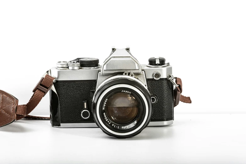 an old style camera, with the strap on