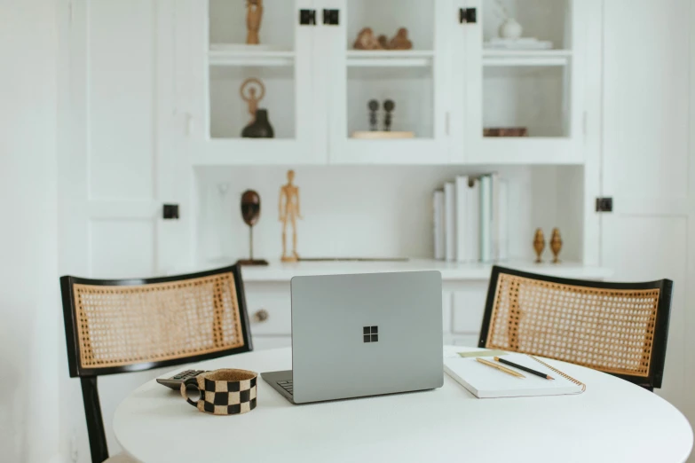 the computer is sitting on the table alone