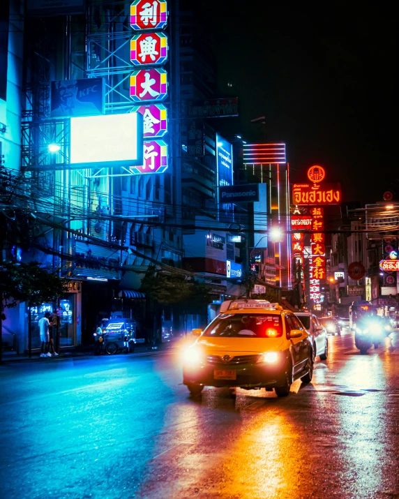 the view from the back of a taxi cab thats on a city street, at night