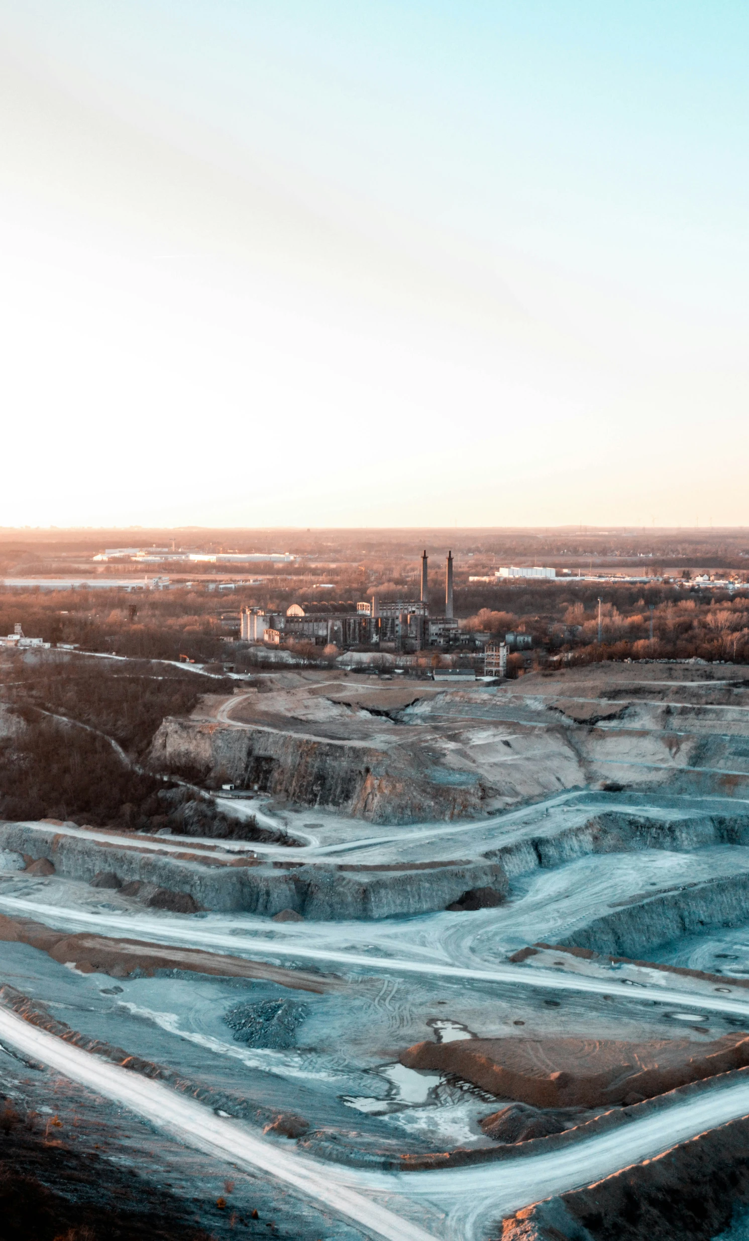 a large industrial facility sitting on top of an industrial land