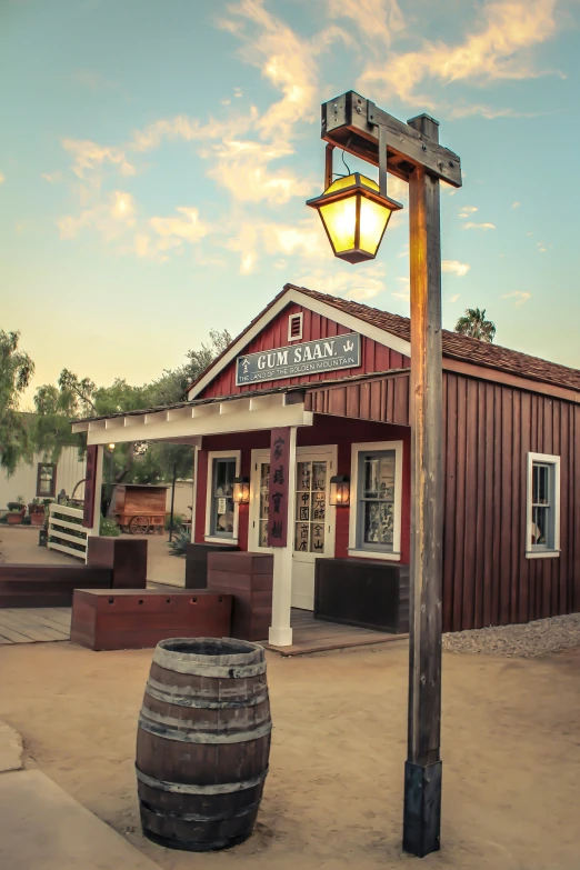 a lightpost stands in front of a restaurant