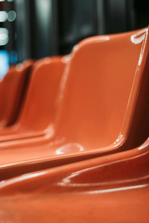 red chairs sit lined up in an empty area