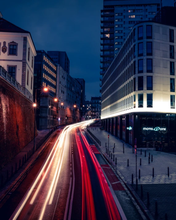 a long exposure image of traffic in the city